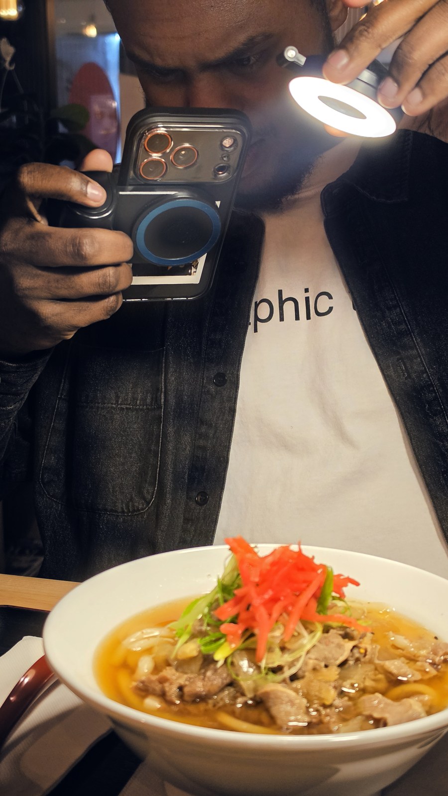 Zazi filming with his iPhone and lighting rig