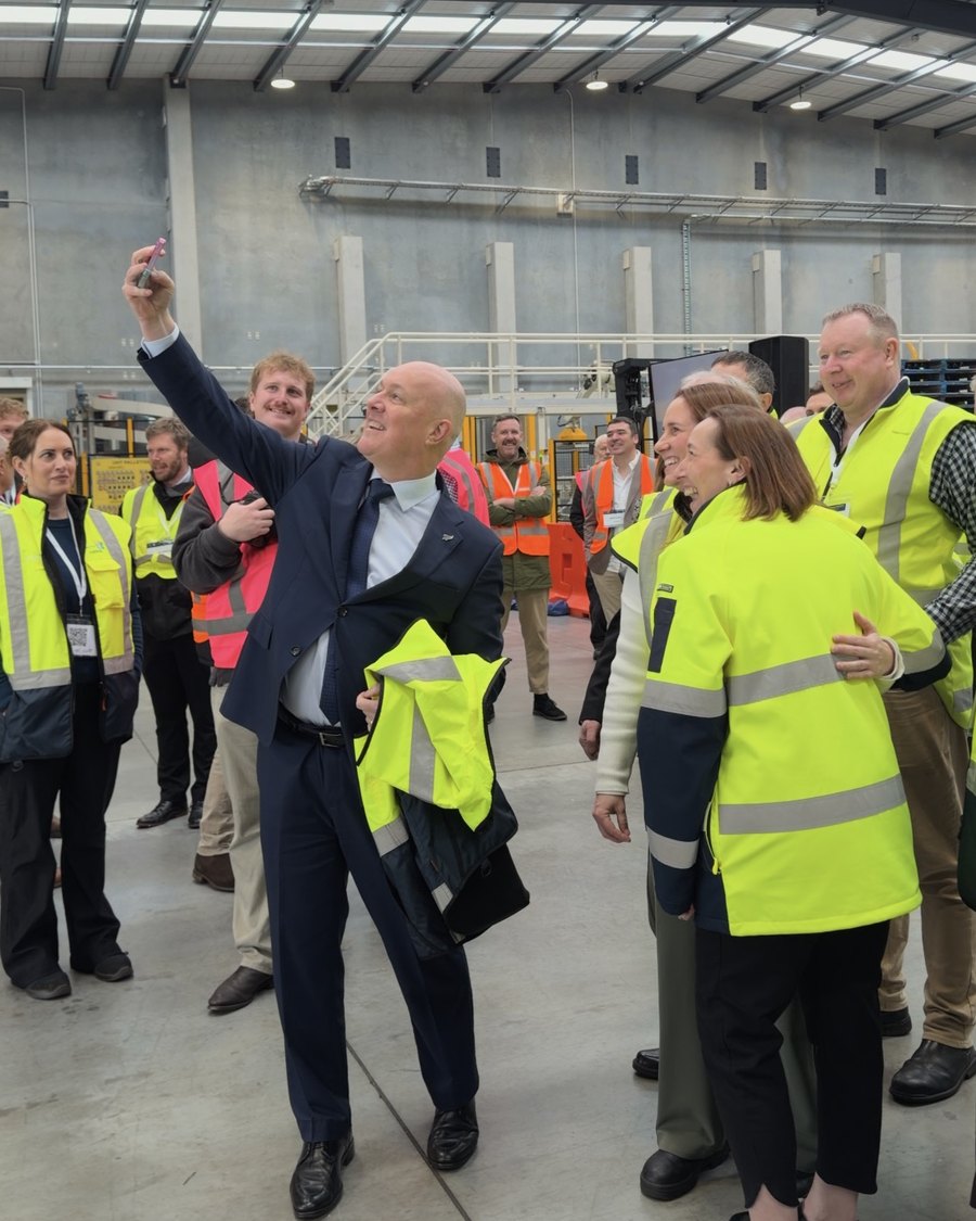 The Prime Minister taking a selfie with the crowd on the factory floor